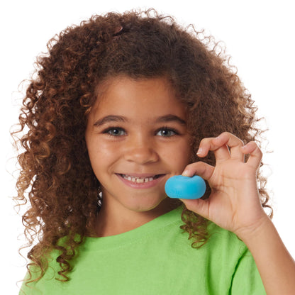 Girl holding blue Nee Doh Teenie Rainbow squishy