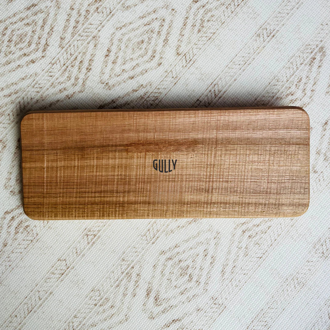 Gully Boards Narrow balance board with half cork on floor