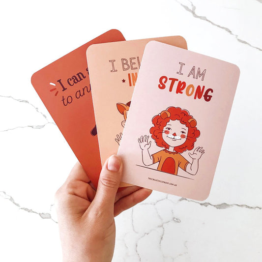 Hand holding Creative Sprout Affirmation Cards