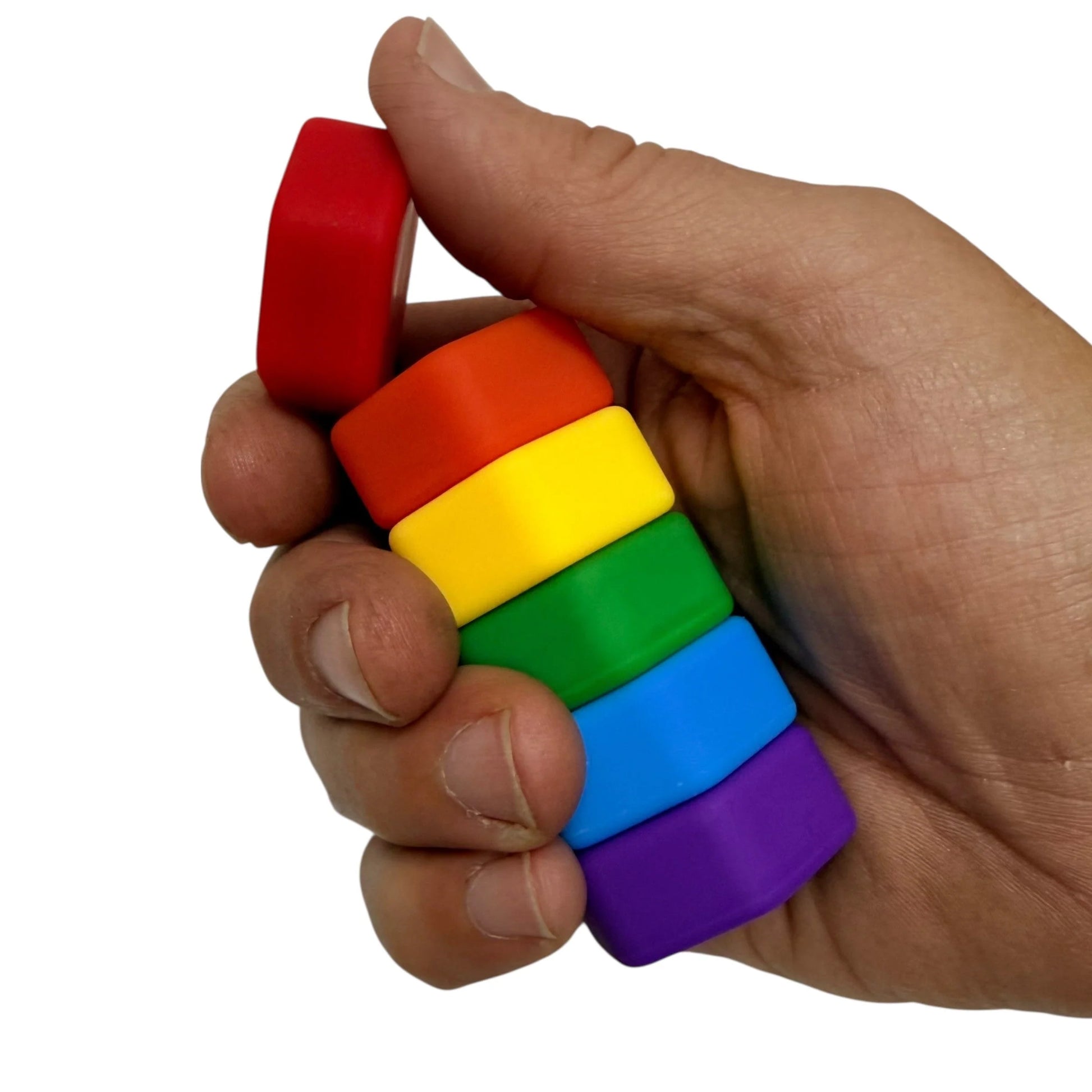 Hand holding Kaiko Magstak Hive Rainbow magnetic fidget pieces
