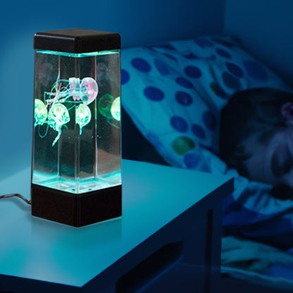 Jinx Jellyfish Mood Lamp next to childs bed