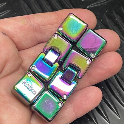 Kaiko Mini Infinity Cube Oil Slick in hand