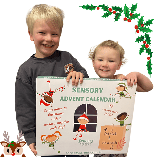 Kids holding Deluxe Advent Fidget Calendar