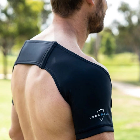 Man wearing iron back support