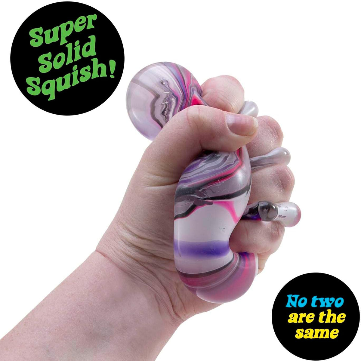 Needoh cube in hand being squished showing black, pink and purple swirls