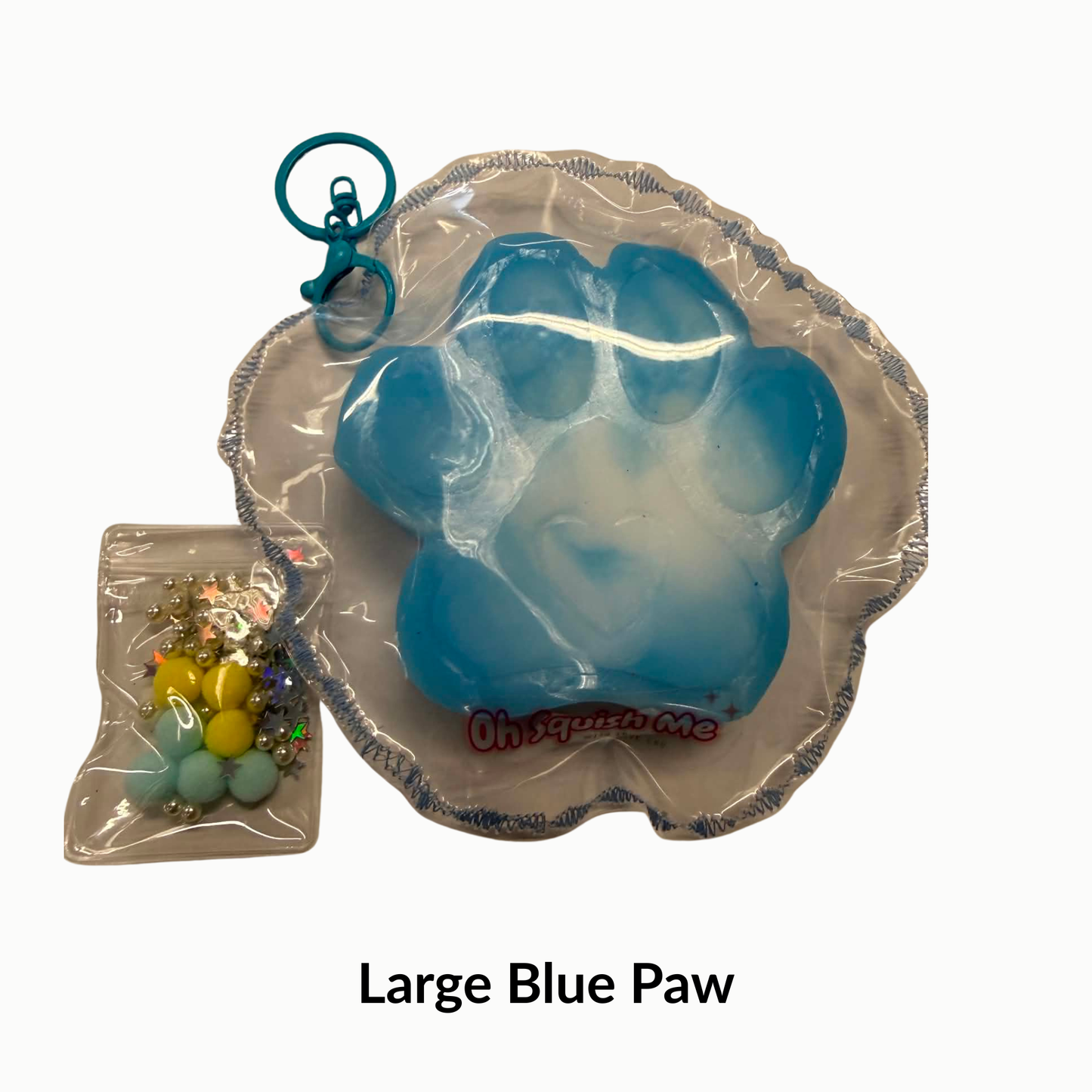 Large blue paw-shaped product with a keychain attached on a white background