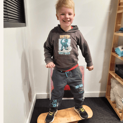 Boy on Wooden Balance Board