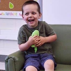 Senseez Soothables – Mini Handheld Vibrating Massager boy laughing