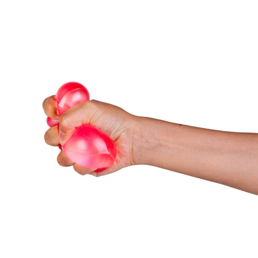 Smoosho Polyhedron Jelly Squishy pink being squeezed