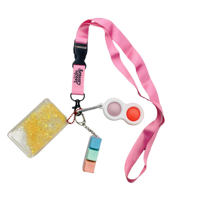 pink lanyard with 3 fidgets attached