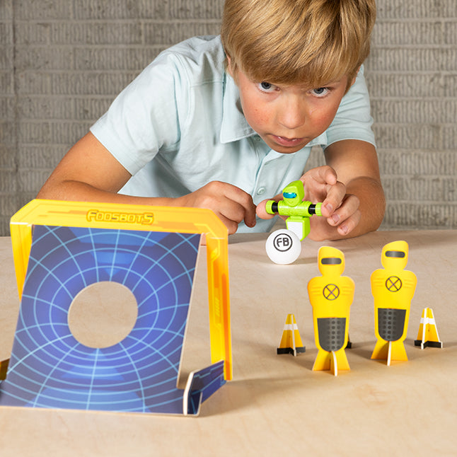 Boy with Foosbots Stadium Battle training