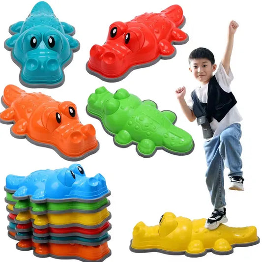boy balancing on crocodile shaped stepping stones