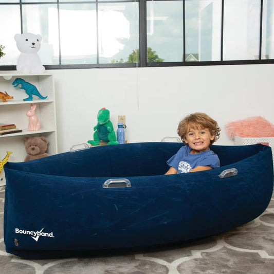 Boy sitting in Playlearn Peapod Medium
