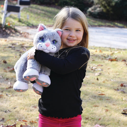 Girl holding Chloe the weighted comfort cat