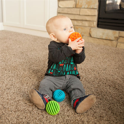 toddler mouthing Sensory Rollers balls