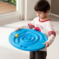Boy using Weplay maze balance board