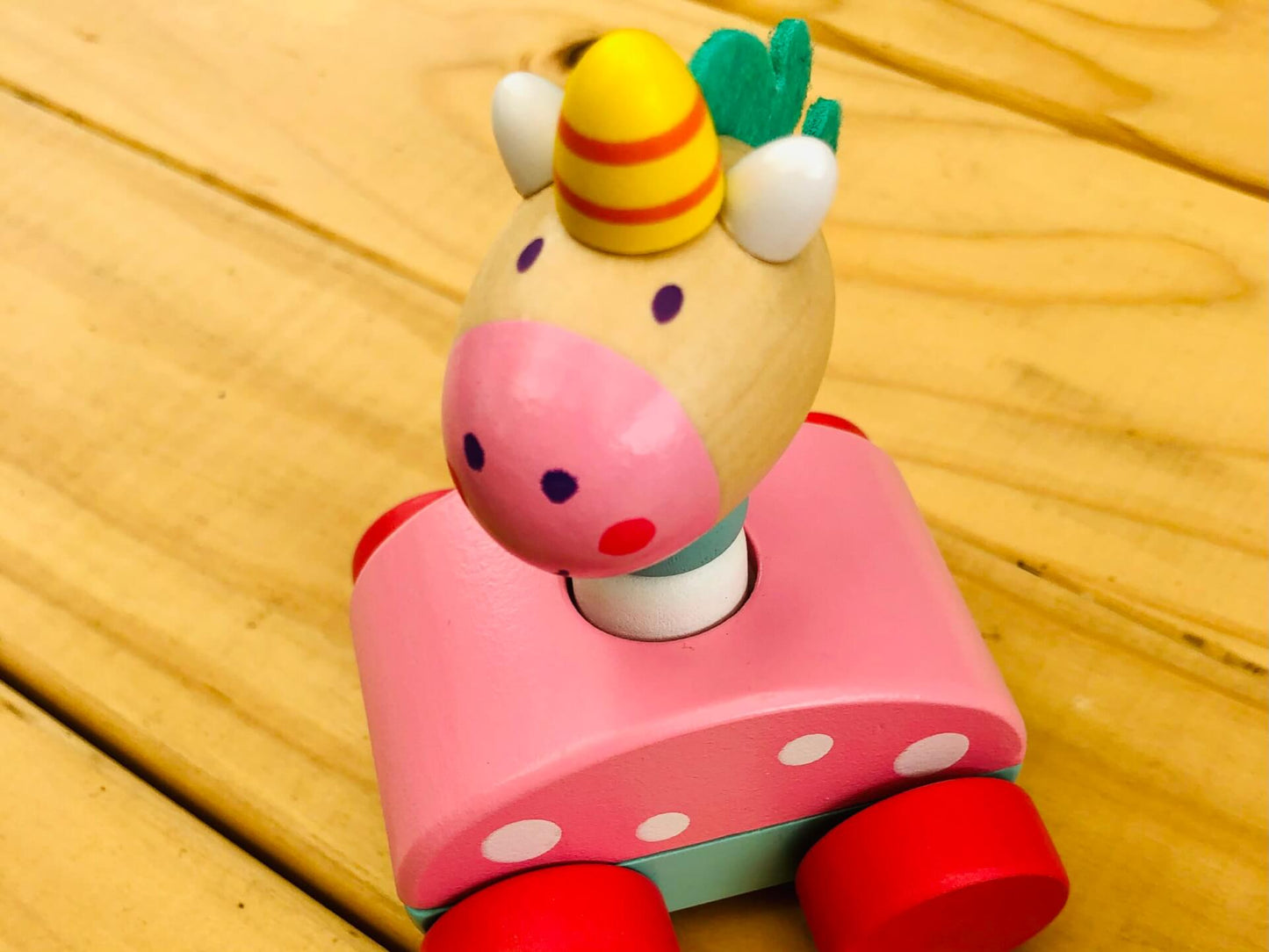 wooden unicorn pink toy